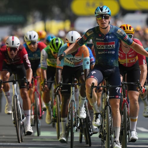 Belgium's Tim Merlier celebrates as he crosses the finish line to win the seventh stage of the Tour de France cycling race with start in Hagetmau and finish in Bordeaux, France, Friday, July 10, 2026. (AP Photo/Thibault Camus)