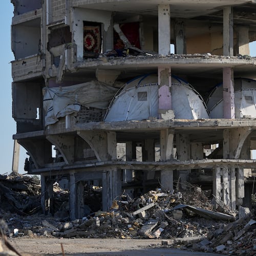 Tents are set up inside a gutted apartment building in Khan Younis, in the southern Gaza Strip, Saturday, Nov. 15, 2025. (AP Photo/Abdel Kareem Hana)
