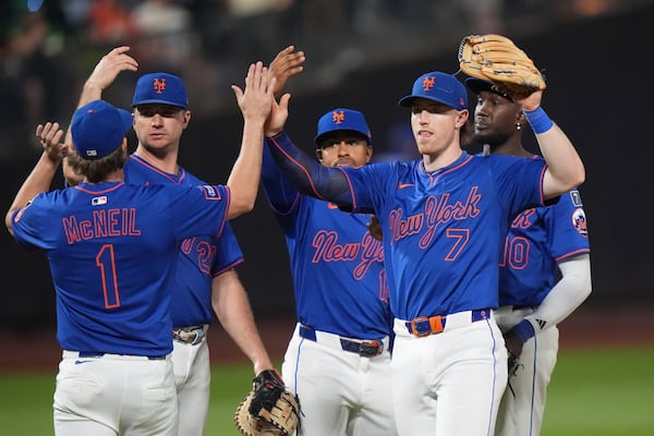 New York Mets' Jeff McNeil (1) and Brett Baty (7) celebrate with teammates after a baseball game against the Atlanta Braves Thursday, June 26, 2025, in New York. (AP Photo/Frank Franklin II)