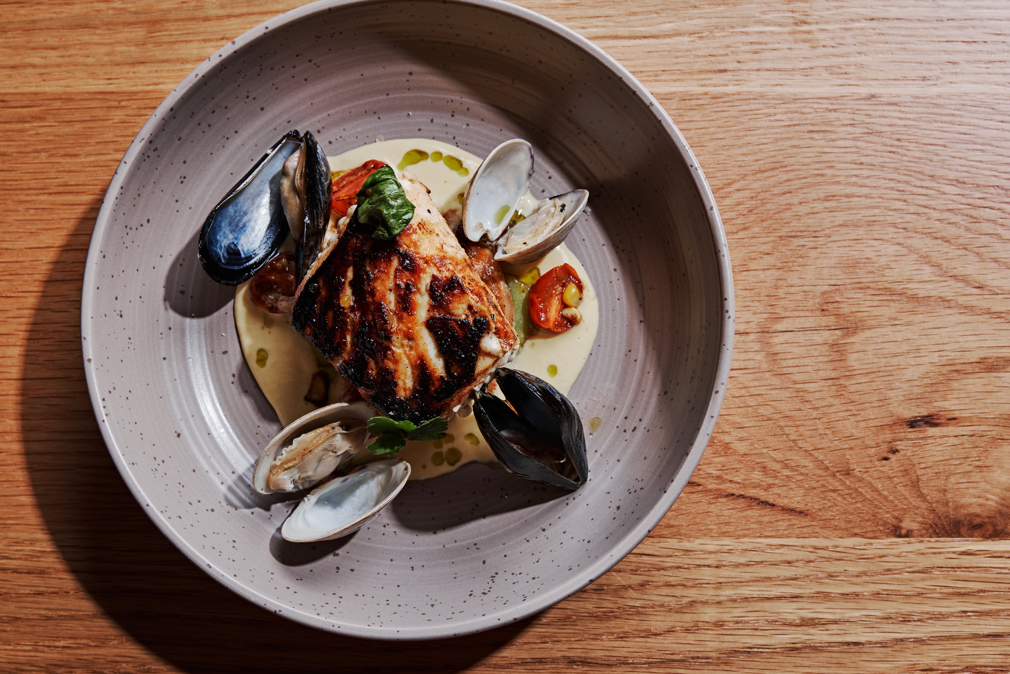 Marcus’ menu offers oysters on the half shell, steaks, barbecue and signature items like brown sugar wings, fried chicken and cornbread waffles, and Old Bay crab cakes. (Courtesy of Andrew Thomas Lee)