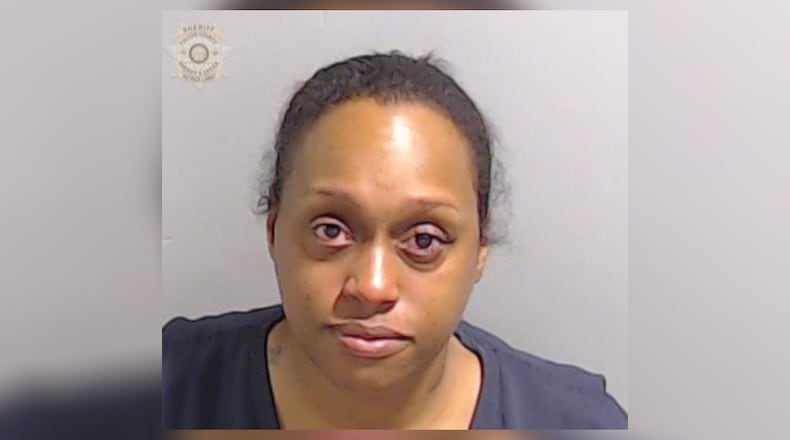 Fulton County detention officer Kawana Jenkins, 36, was arrested and fired after she was accused of having inappropriate behavior with an inmate, authorities said.