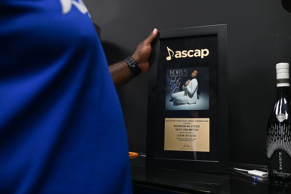 Richard Dunn, co-founder of Rolling Out Magazine and Rolling Out Music Co., holds an ASCAP Rhythm & Soul Award presented to fellow co-founder Munson Steed, on Tuesday, June 30, 2026 in Atlanta. (Natrice Miller for the AJC)