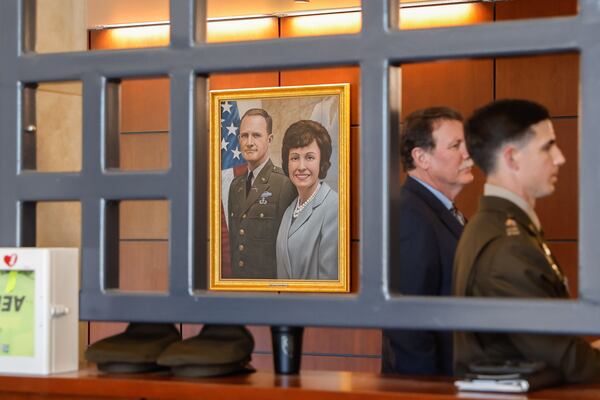 A portrait of Lt. Gen. Hal Moore and his wife, Julie, hangs inside McGinnis-Wickam Hall at Fort Benning. The base was named Fort Moore in their honor from 2023-25. (Natrice Miller/AJC)