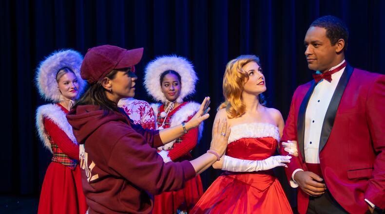 Sara Edwards works through one of the many scenes of 'White Christmas" with the cast at City Springs Theatre.