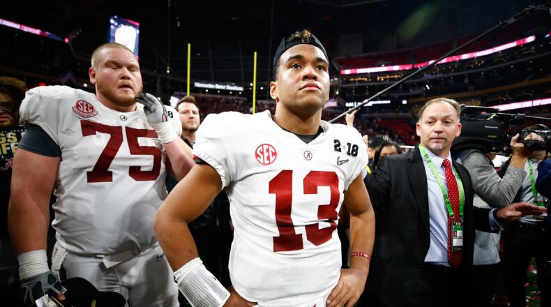 ATLANTA, GA - JANUARY 08: Tua Tagovailoa #13 of the Alabama Crimson Tide stands on the field after beating the Georgia Bulldogs in overtime to win the CFP National Championship presented by AT&T at Mercedes-Benz Stadium on January 8, 2018 in Atlanta, Georgia. The Alabama Crimson Tide won 26-23. (Photo by Jamie Squire/Getty Images)
