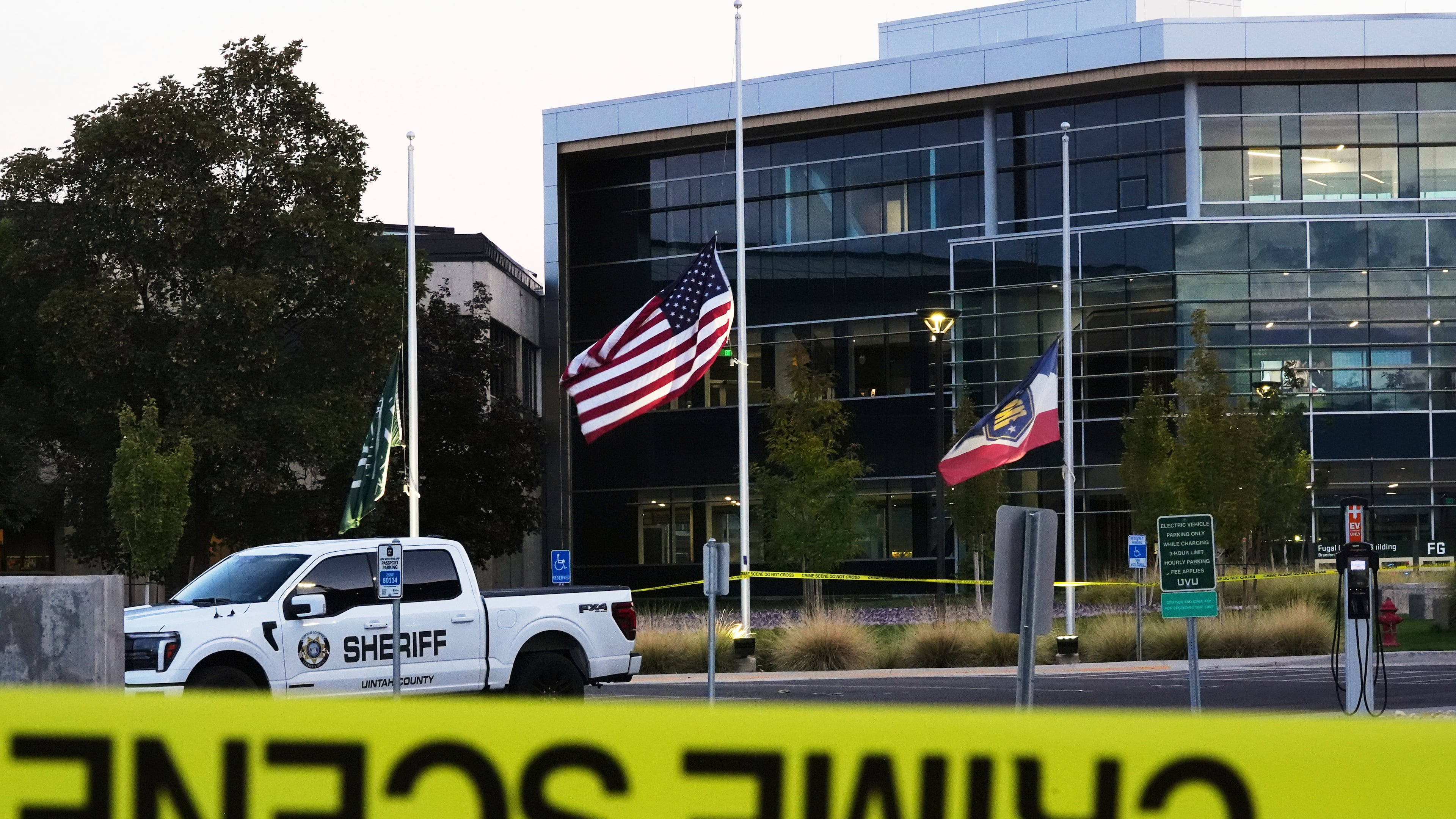 Crime scene tape surrounds Utah Valley University after Turning Point USA CEO and co-founder Charlie Kirk was shot and killed , Saturday, Sept. 13, 2025, in Orem, Utah. (AP Photo/Lindsey Wasson)