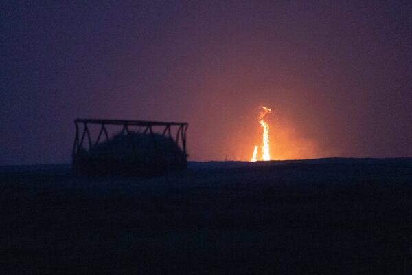 A wildfire burns through a field Friday, March 14, 2025, south of Langston, Okla. (AP Photo/Alonzo Adams)