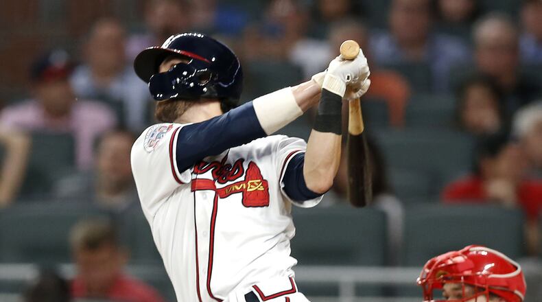 Braves shortstop Dansby Swanson hits a 3-run home run in the fifth inning against the Philadelphia Phillies at SunTrust Park Wednesday, June 7, 2017 in Atlanta.