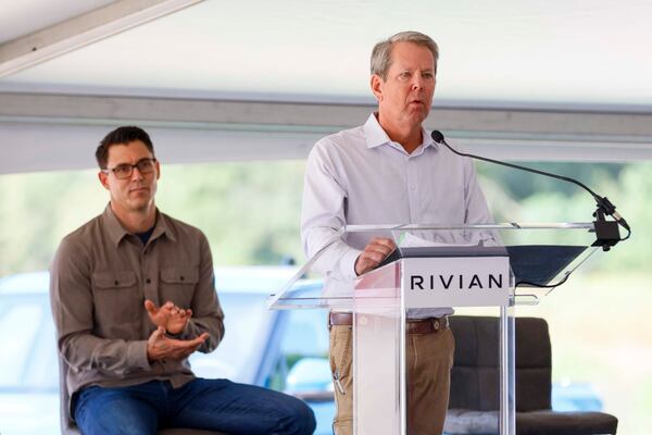 Gov. Brian Kemp delivers his remarks as Rivian CEO, RJ Scaringe, applauds just moments before the groundbreaking ceremony on Tuesday, Sept. 16, 2025, in Walton and Morgan counties.
(Miguel Martinez/AJC)