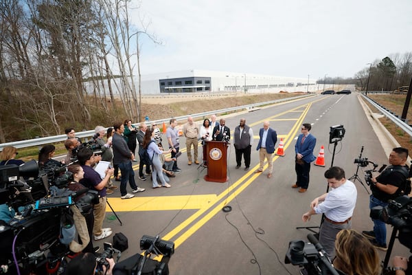Sen. Raphael Warnock (center) and Social Circle officials address members of the media Monday, March 2, 2026, outside the proposed site of an ICE detention center. The city’s leaders have expressed concerns about a lack of the necessary infrastructure to support the facility. (Miguel Martinez/AJC)
