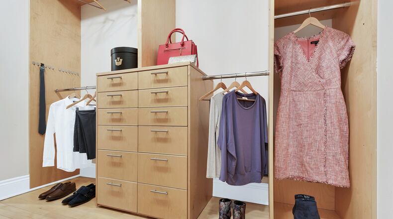 A built-in closet is made more attractive through the use of props and lifestyle elements. (Design Recipes)