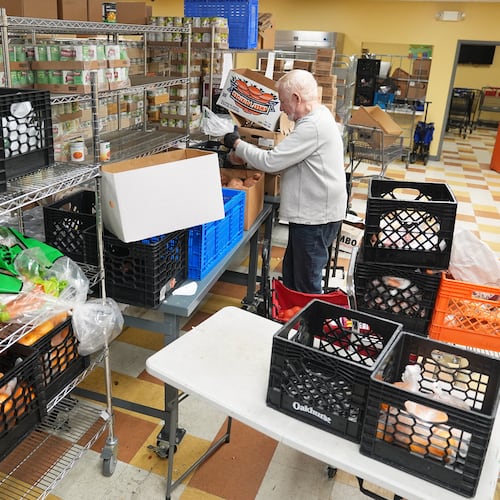 Volunteer Bruce Toben packs groceries durning an emergency food distribution at the at The Jewish Federation of Greater Philadelphia's Mitzvah Food Program in Philadelphia, Friday, Nov. 7, 2025. (AP Photo/Matt Rourke)