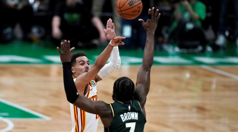 Game-winner: Trae Young (11) takes the game-winning shot over Boston Celtics guard Jaylen Brown (7) during the final seconds of Game 5 in a first-round NBA basketball playoff series Tuesday, April 25, 2023, in Boston. (AP Photo/Charles Krupa)