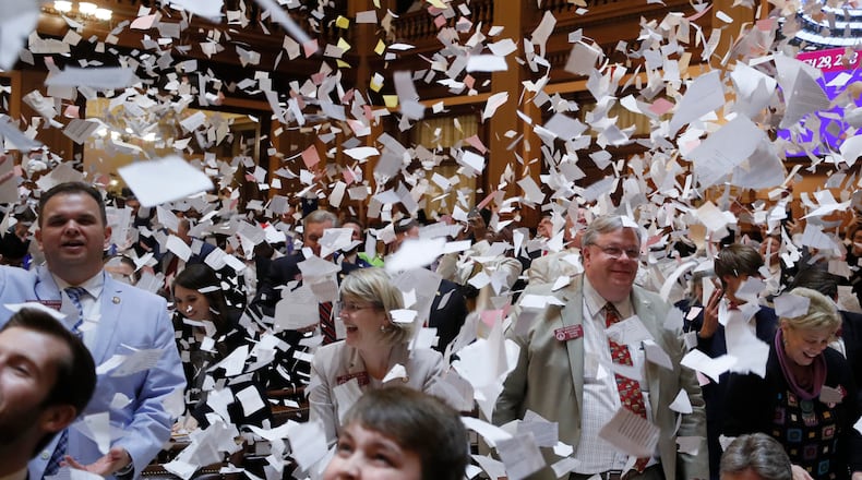 3/29/18 - Atlanta - House members toss papers in the air as Sine Die was proclaimed shortly after midnight.  Thursday was the 40th and final day of the 2018 General Assembly.    BOB ANDRES  /BANDRES@AJC.COM