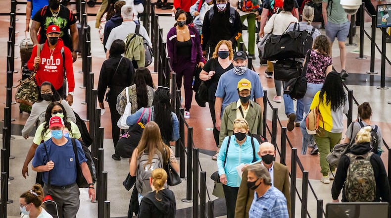 Long lines form at Hartsfield-Jackson Atlanta International Airport Sunday, May 9, 2021. STEVE SCHAEFER FOR THE ATLANTA JOURNAL-CONSTITUTION