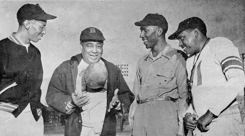 The coaching staff for the Wolverines of Morris Brown College are shown in this b/w photo copied from a 1951 football program. L to R, they are: William T. Greene, backfield coach; Edward J. Clemmons, head coach; Clarence O. Brown, line coach; and Thomas L. Caldwell, asst. line coach. (AJC file photo)