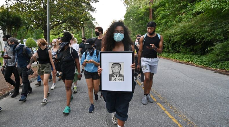Protesters march in Buckhead neighbor after they rallied across the street from the Governor’s Mansion in Buckhead on Saturday, May 30, 2020. A second day of protests Saturday began with a crowd outside the Governor’s Mansion and grew to include demonstrations in downtown Atlanta. Mayor Keisha Lance Bottoms issued a curfew for the city following a night of chaotic protests Friday that led to vandalism and looting in parts of downtown Atlanta and Buckhead. HYOSUB SHIN / HYOSUB.SHIN@AJC.COM