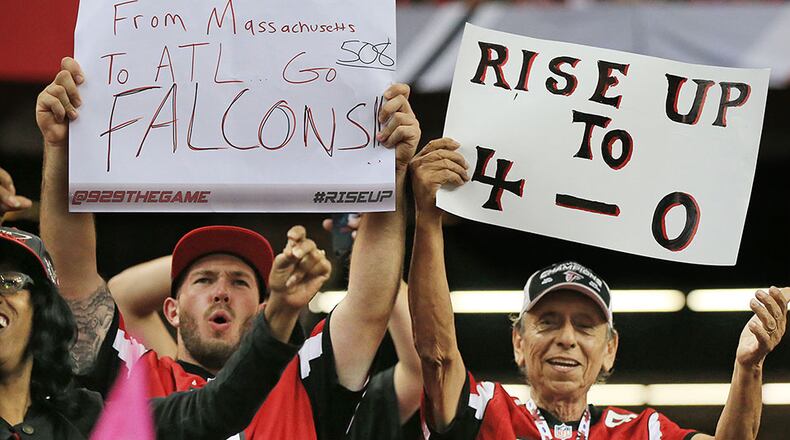 100415 ATLANTA: Falcons fans cheer as the team improves to 4-0 with a 48-21 victory over the Texans in a football game on Sunday, Oct. 4, 2015, in Atlanta. Curtis Compton / ccompton@ajc.com