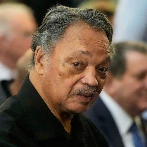 FILE - The Rev. Jesse Jackson listens to speakers at the Tabernacle Baptist Church during the 60th anniversary of the march to ensure that African Americans could exercise their constitutional right to vote, March 9, 2025, in Selma, Ala. (AP Photo/Mike Stewart, File)