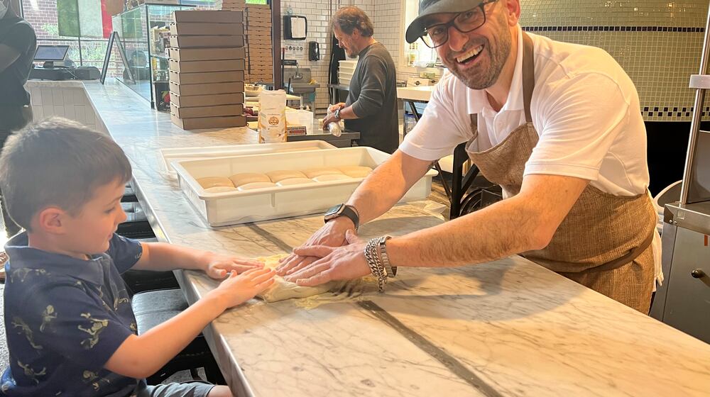 Patrizio Alaia of Mozza Bella will help young guests shape a bit of dough, and then he'll bake it for them. Courtesy of Mozza Bella