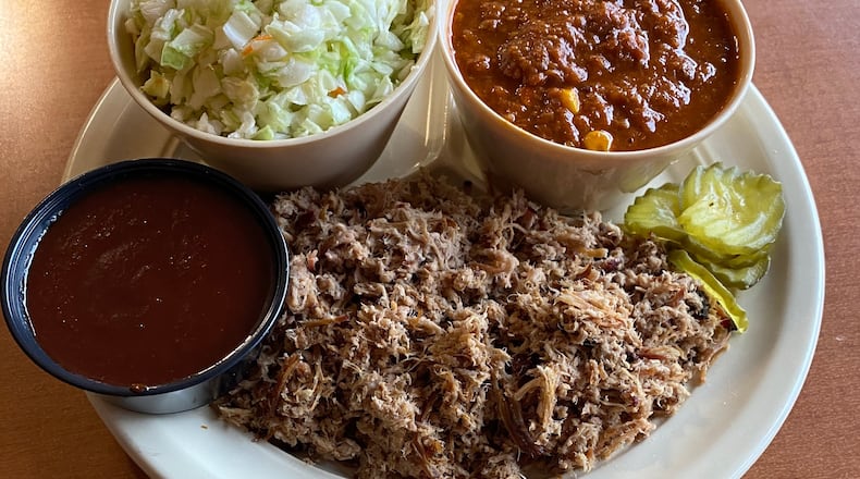 Old South Bar-B-Q’s Cole Slaw alongside the restaurant’s Brunswick stew, chopped BBQ pork and a dish of their original barbecue sauce.  
Courtesy of Joy Llewallyn