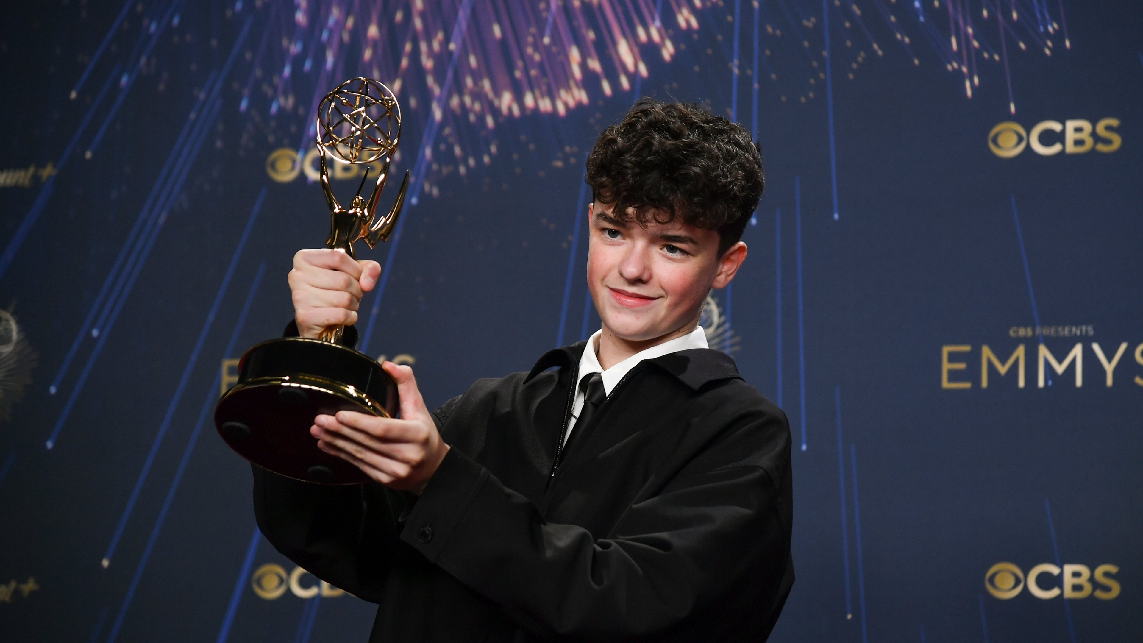 Owen Cooper, winner of the award for outstanding supporting actor in a limited or anthology series or movie for "Adolescence," poses in the press room during the 77th Primetime Emmy Awards on Sunday, Sept. 14, 2025, at the Peacock Theater in Los Angeles. (Photo by Richard Shotwell/Invision/AP)