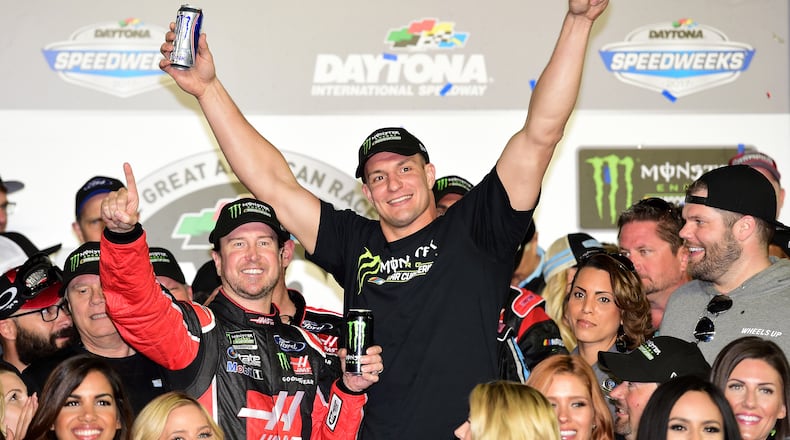 Daytona 500 winner Kurt Busch celebrates his Daytona 500 win with New England Patriots tight end Rob Gronkowski. (Jared C. Tilton/Getty Images)