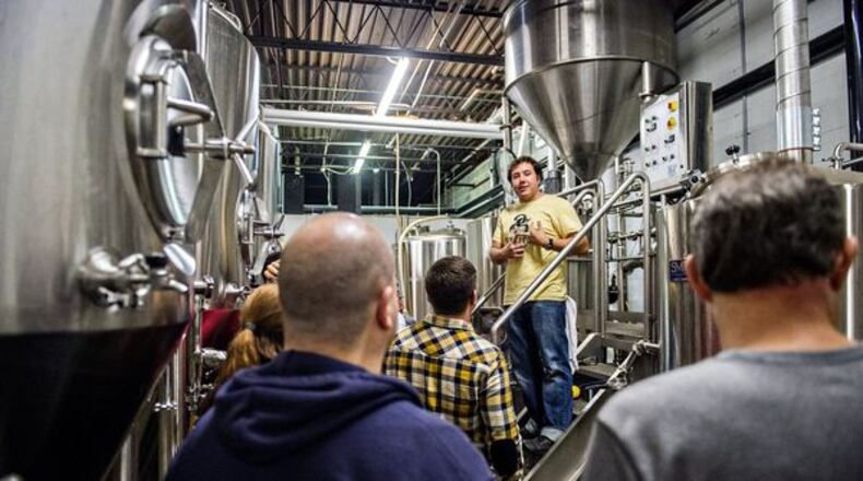 October 3, 2015 Atlanta - Jason Santamaria (center) leads a brewery tour during the Second Self Beer Company’s one year anniversary celebration in Atlanta on Saturday, October 3, 2015. The brewery had 16 different beers to sample during the celebration. JONATHAN PHILLIPS / SPECIAL