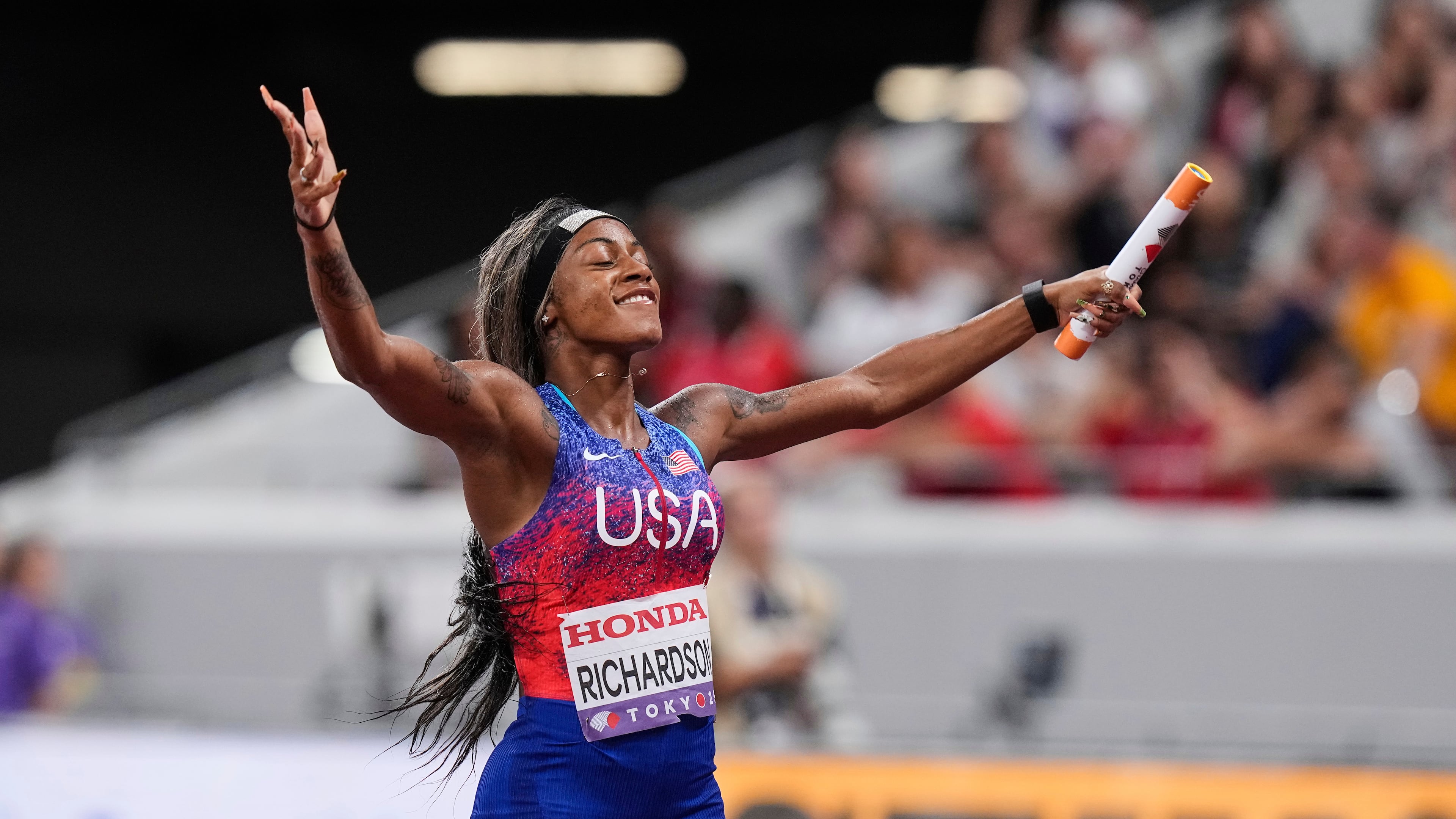 United States' Sha'Carri Richardson reacts after winning the women's 4 X 100 meters relay at the World Athletics Championships in Tokyo, Sunday, Sept. 21, 2025. (AP Photo/Eugene Hoshiko)