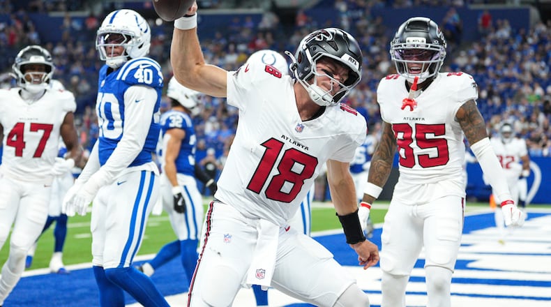 Atlanta Falcons quarterback Jack Strand (18) celebrates a touchdown against the Indianapolis Colts during the second half of an NFL football game in Indianapolis, Saturday, Aug. 22, 2026. (AP Photo/AJ Mast)