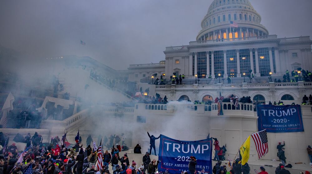 Tear gas is fired at supporters of President Donald Trump who stormed the U.S. Capitol on Jan. 6, 2021. (Evelyn Hockstein for The Washington Post)