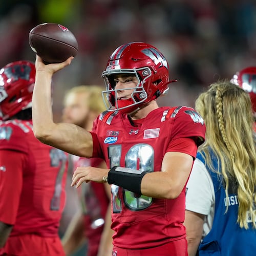 FILE - Wisconsin quarterback Ryan Hopkins (10) throws on the sidelines during the second half of an NCAA college football game against Notre Dame Sunday, Sept. 6, 2026, in Green Bay, Wis. (AP Photo/Kayla Wolf, File)