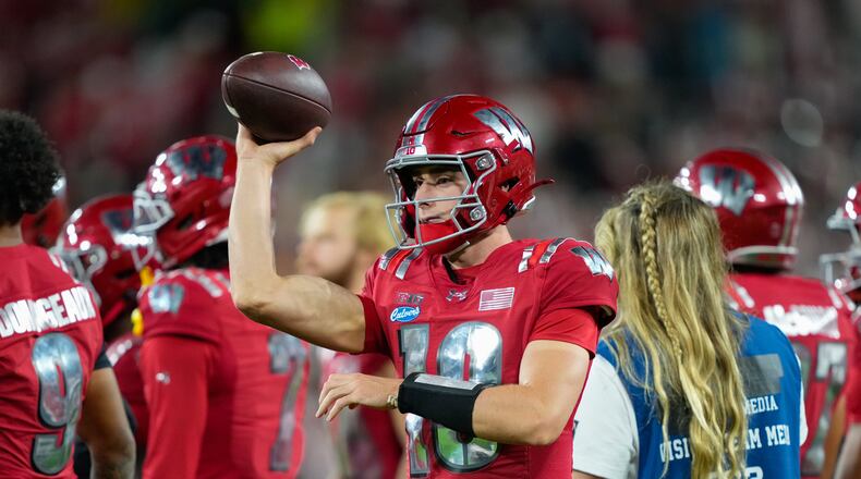 FILE - Wisconsin quarterback Ryan Hopkins (10) throws on the sidelines during the second half of an NCAA college football game against Notre Dame Sunday, Sept. 6, 2026, in Green Bay, Wis. (AP Photo/Kayla Wolf, File)
