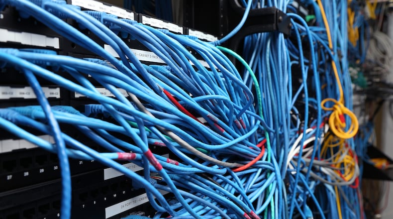 Network cables are plugged in a server room on November 10, 2014 in New York City. (Photo by Michael Bocchieri/Getty Images)