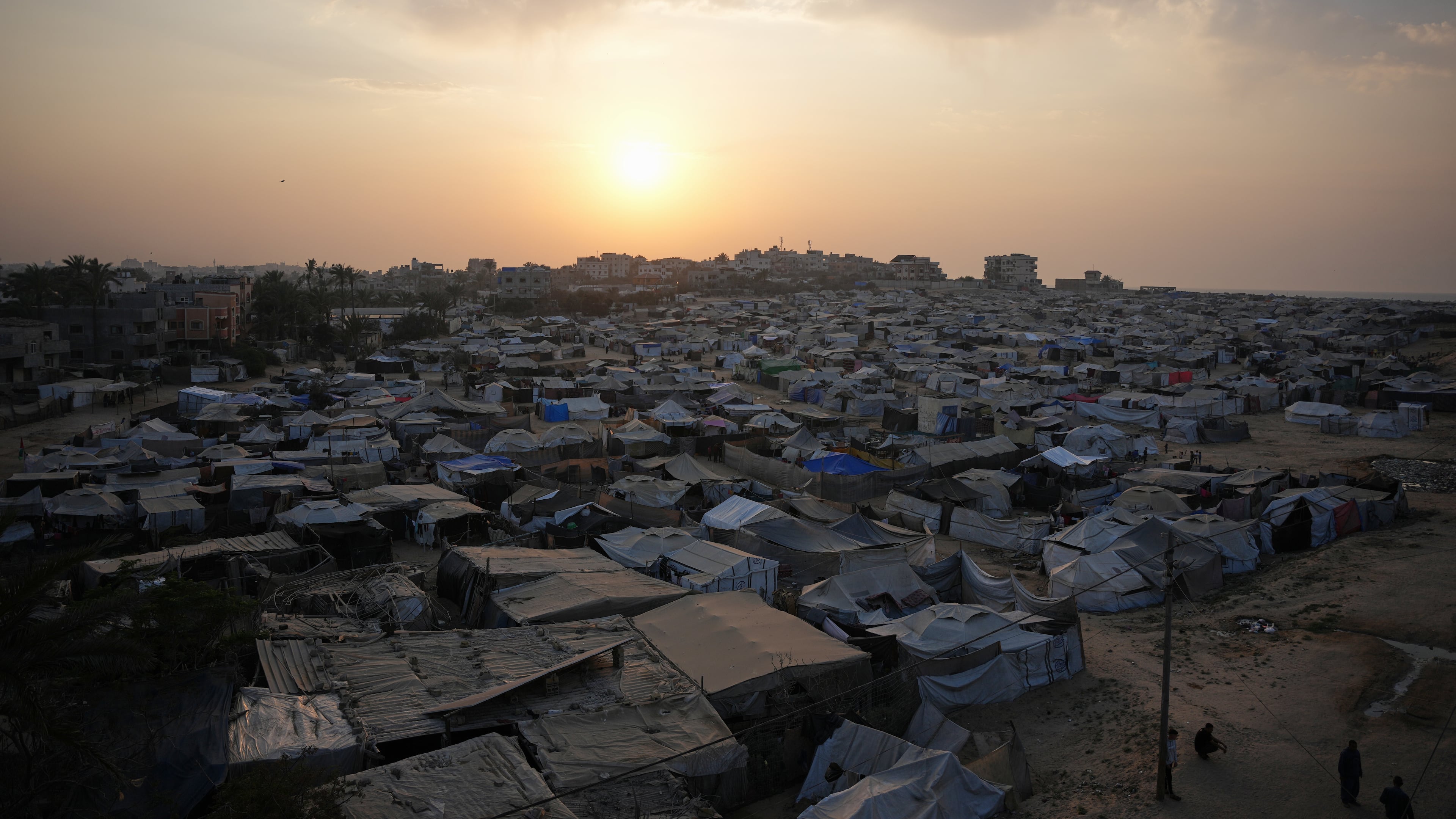 A tent camp for displaced Palestinians stretches along Zawaida in the central Gaza Strip on Tuesday, Nov. 4, 2025. (AP Photo/Abdel Kareem Hana)