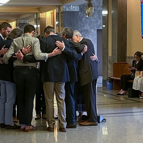 FILE - Covenant School parents and their attorneys huddle in prayer outside a courtroom before a hearing to decide whether documents and journals of a Nashville school shooter can be released to the public April 17, 2024, in Nashville, Tenn. (AP Photo/Travis Loller, File)