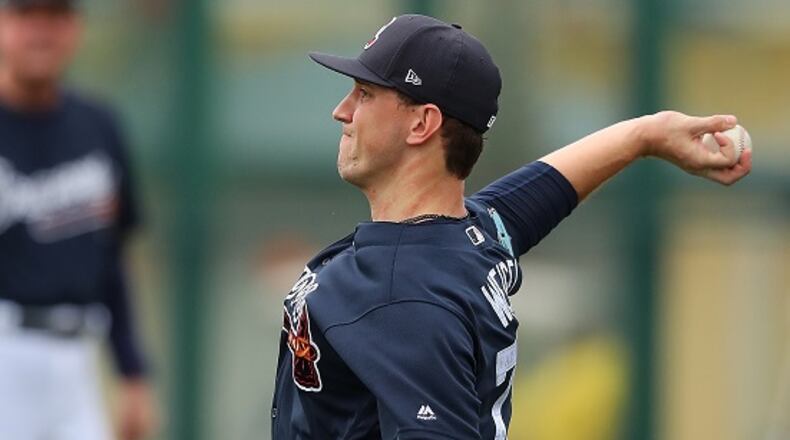 February 18, 2017, Lake Buena Vista, FL: Atlanta Braves pitcher Patrick Weigel throws to loosen up his arm the first full squad workout on Saturday Feb. 18, 2017, at the ESPN Wide World of Sports in Lake Buena Vista.   Curtis Compton/ccompton@ajc.com