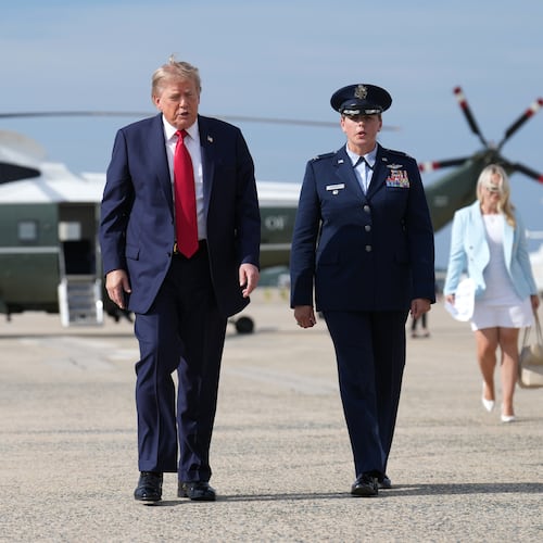 President Donald Trump, left, walks from Marine One to board Air Force One, Friday, Aug. 21, 2026, at Joint Base Andrews, Md., en route to South Carolina. (AP Photo/Jacquelyn Martin)