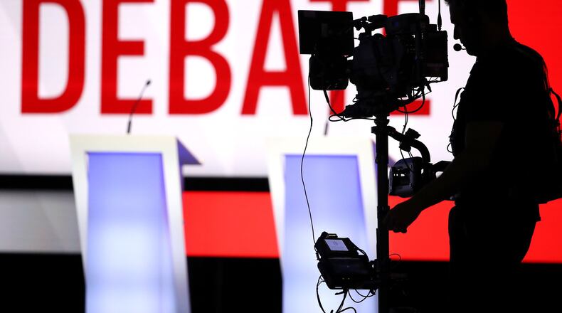 A camera operator works in front of the stage before Tuesday’s Democratic presidential debate at Otterbein University in Westerville, Ohio. The next debate is scheduled for Nov. 20 in Georgia. A location has yet to be selected, although the event is expected to be held in metro Atlanta. (Photo by Win McNamee/Getty Images)