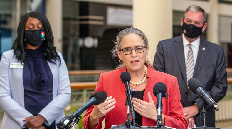 U.S. Rep. Carolyn Bourdeaux talks during a press conference flanked by Gwinnett County Commissioner Chairwoman Nicole Love Hendrickson (L) and County Community Improvement District Director Joe Allen (R) at the Gwinnett Place Mall in Duluth STEVE SCHAEFER FOR THE ATLANTA JOURNAL-CONSTITUTION