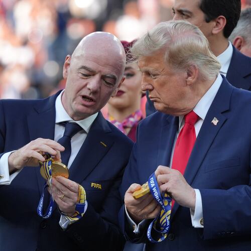 FIFA President Gianni Infantino, left, and President Donald Trump comment on the medals as they wait to congratulate the Spanish players after the World Cup final soccer match between Spain and Argentina in East Rutherford, N.J., near New York, Sunday, July 19, 2026. (AP Photo/Jacquelyn Martin)