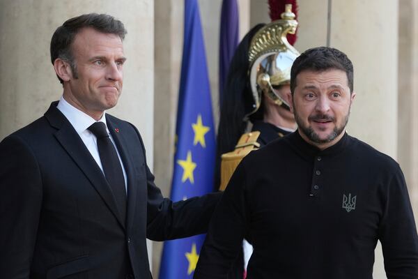 French President Emmanuel Macron, left, welcomes Ukrainian President Volodymyr Zelenskyy before their meeting to prepare Thursday's gathering of the so-called "coalition of the willing" nations that are allies of Ukraine, Wednesday, March 26, 2025 at the Elysee Palace in Paris. (AP Photo/Thibault Camus)