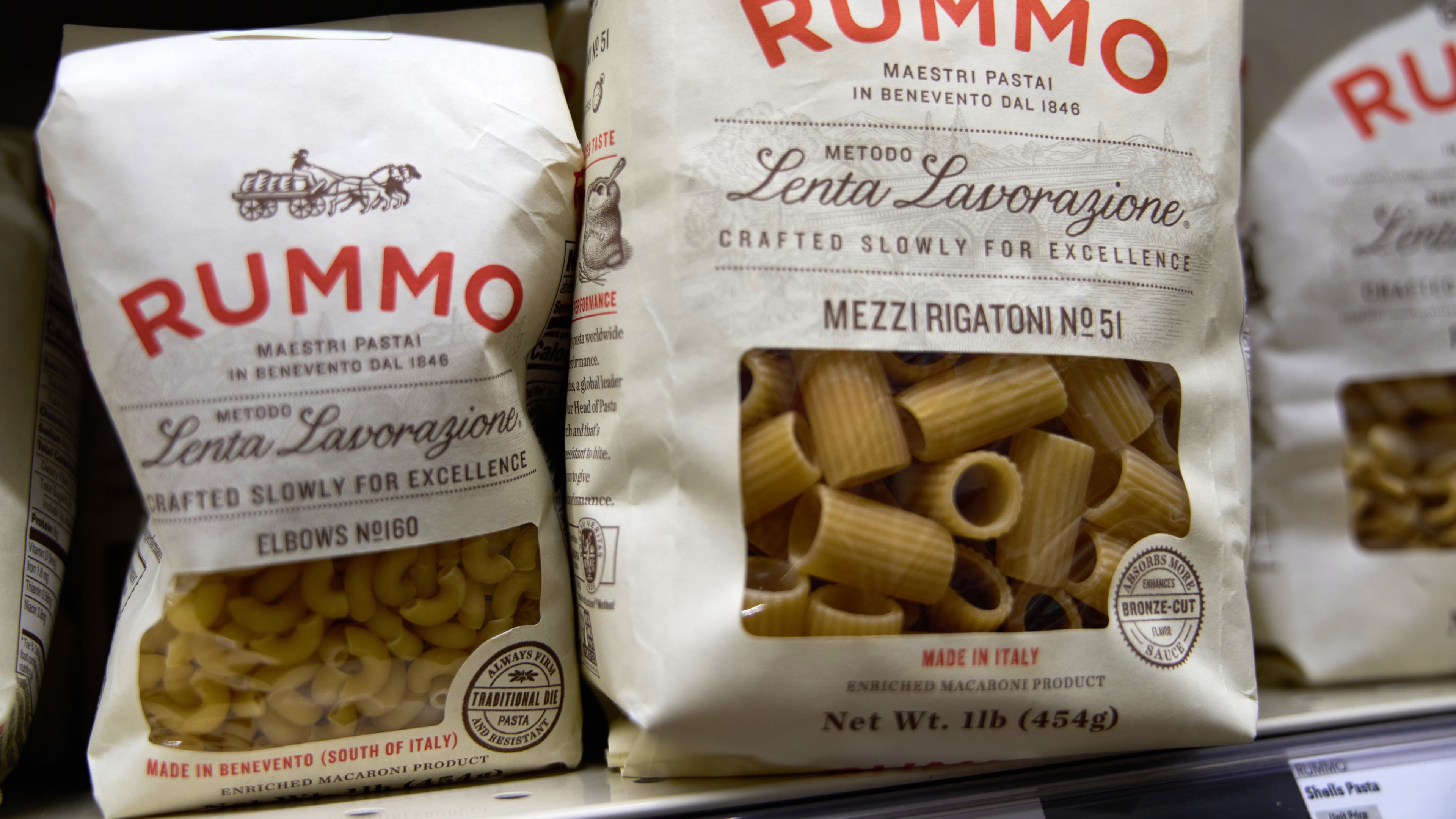 Packages of imported Italian pasta sit on shelves Tuesday, Nov. 11, 2025, in Detroit. (AP Photo/Ryan Sun)