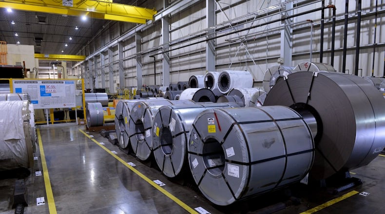 Rolls of sheet steel prepared for cutting and stamping at the Sewon America auto parts plant in LaGrange. Sewon, which makes parts for Kia and Hyundai, is accused of exploiting skilled Mexican workers through a federal visa program. KENT D. JOHNSON / KDJOHNSON@AJC.COM