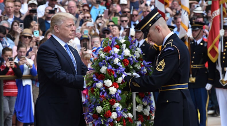 President Donald Trump participates in a wreath-laying ceremony at the Tomb of the Unknown Soldier at Arlington National Cemetery on Memorial Day, May 29, 2017 in Arlington, Virginia.