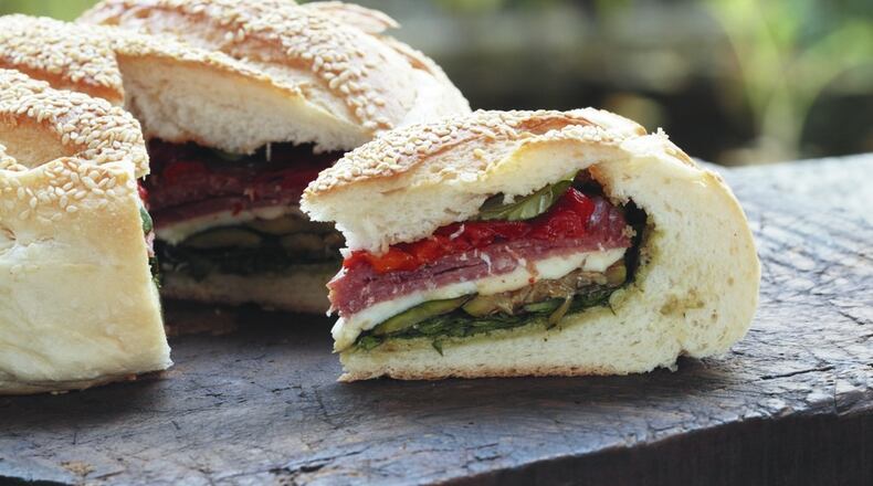 If you need to make a bunch of sandwiches, you can make one big sandwich and then cut it into slices, like this Italian deli-inspired loaf. Contributed by Natasha Milne