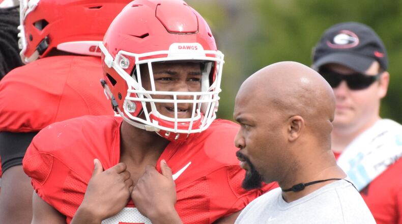 Georgia tailback Zamir White and running backs coach Dell McGee watch the Bulldogs' practice. (Photo by Steven Colquitt / University of Georgia)