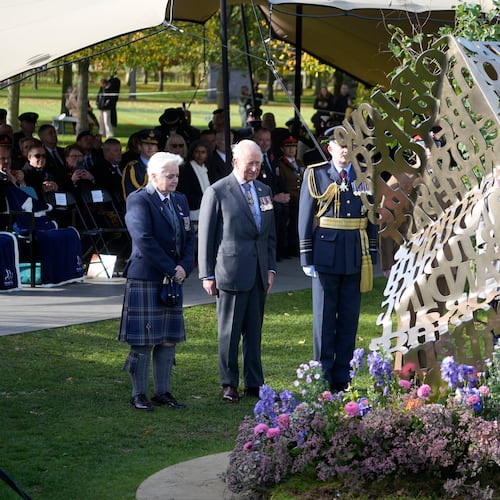 King Charles III stands during a visit to the National Memorial Arboretum in Alrewas, Staffordshire, for the dedication ceremony of the LGBT+ Armed Forces memorial, the UK's first national memorial commemorating LGBT+ people who have served and continue to serve in the military, Monday, Oct. 27, 2025. (Peter Byrne/PA via AP)
