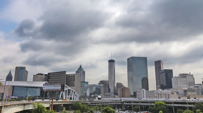 Dark clouds loomed overhead the Atlanta skyline downtown Monday, June 30, 2014 as scattered afternoon storms threatened. Channel 2 Meteorologist Karen Minton forecast for Tuesday will be partly cloudy with isolated afternoon and evening storms. Chance of rain will be 20%. The high will be 93 and the low 72. JOHN SPINK/JSPINK@AJC.COM