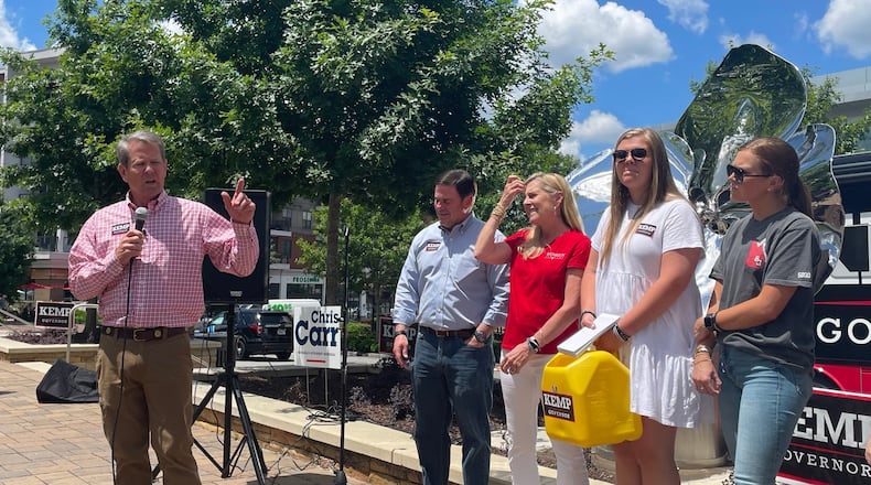 Gov. Brian Kemp campaigns with Arizona Gov. Doug Ducey and members of his family in Sandy Springs on May 14, 2022. Greg Bluestein/AJC
